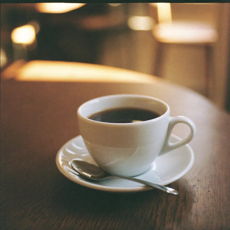A cup of coffee on a wooden table